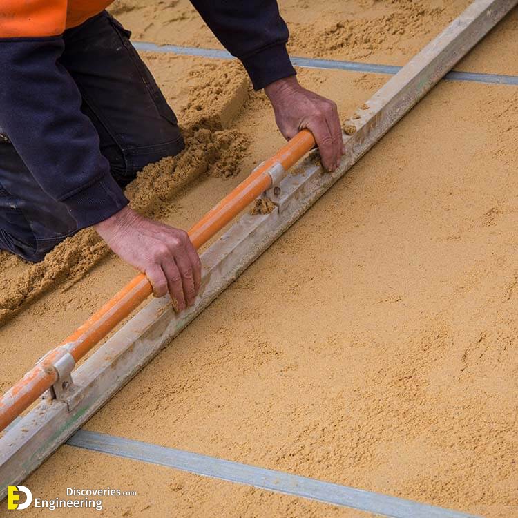 Laying-Pavers-Step-2-Spread-the-sand-and-Screen.jpg