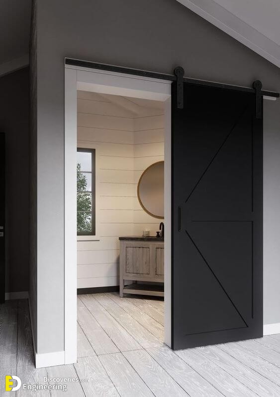 a-black-and-white-sliding-barn-door-brings-a-rustic-feel-with-a-modenr-touch-at-the-same-time.jpg