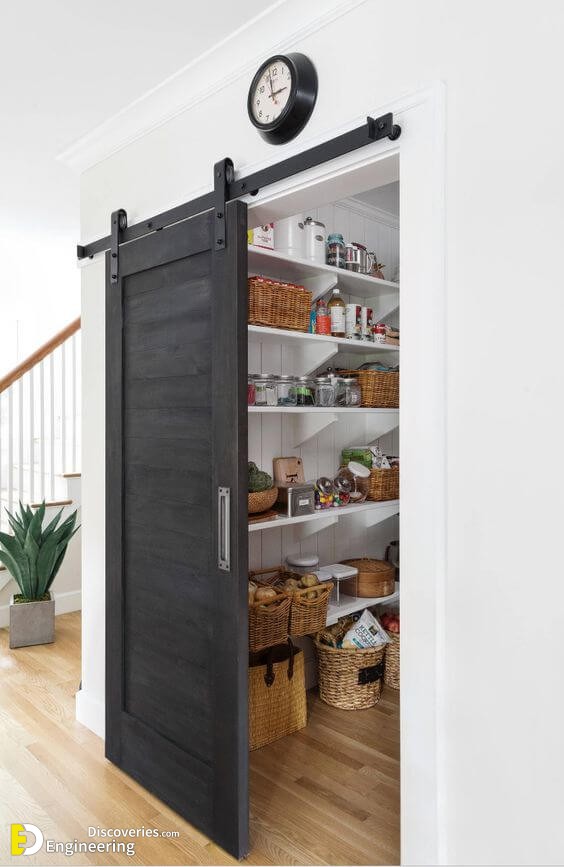 a-grey-sliding-barn-door-hides-the-pantry-and-saves-the-space-very-well.jpg