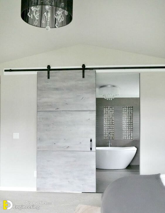 a-modern-grey-sliding-barn-door-for-an-ultra-modern-space-brings-a-rustic-feel-yet-with-a-modern-twist.jpg