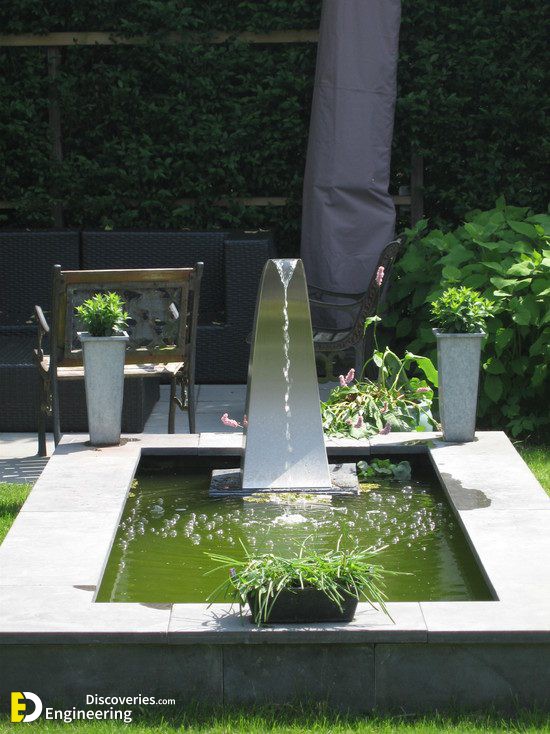 modern-garden-design-stainless-steel-fittings-waterfall-concrete-pool.jpg