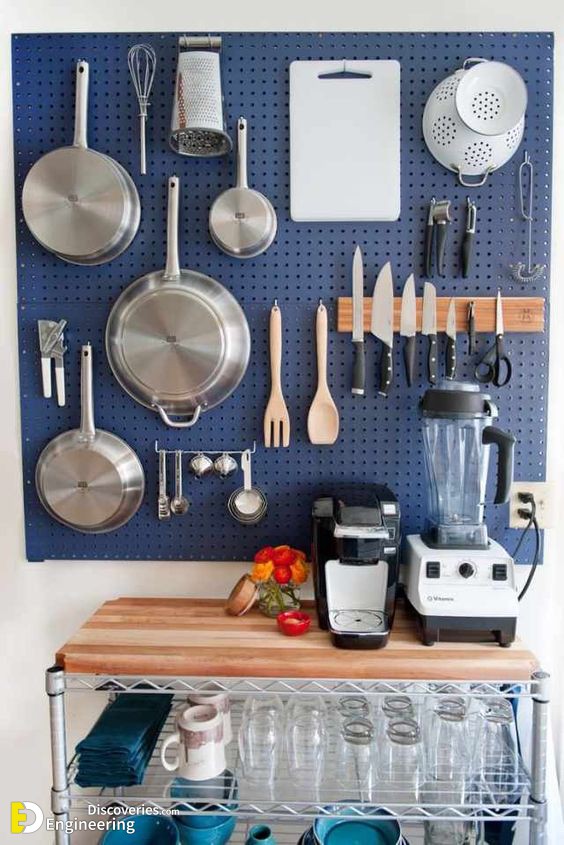 1-a-large-blue-pegboard-with-hooks-and-hangers-holding-various-pans-pots-and-other-stuff-is-a-great-solution-for-a-kitchen.jpg