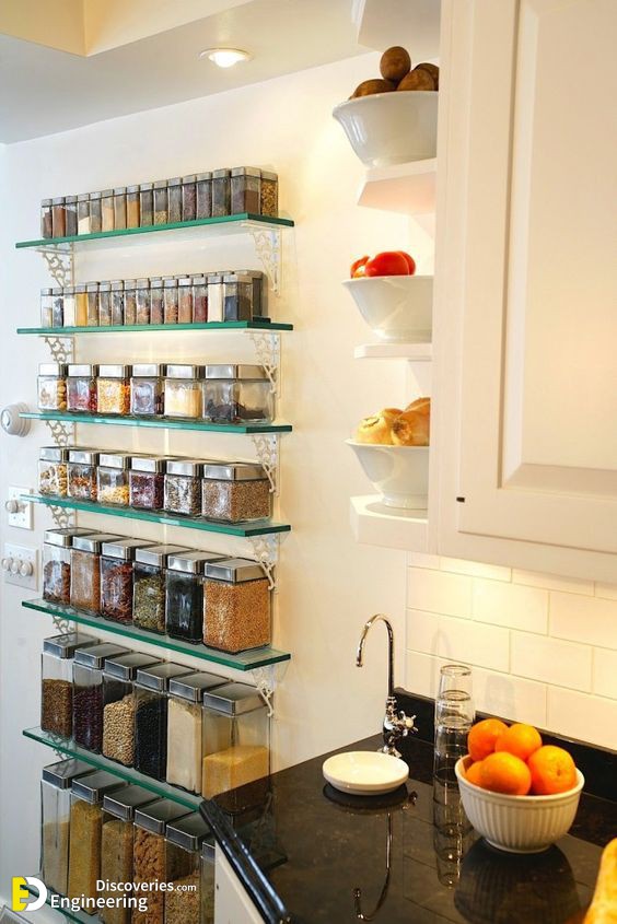 5-open-glass-shelves-for-storing-spices-and-other-food-in-containers-and-some-open-shelves-on-the-side-of-the-cabinet.jpg