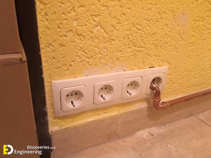 water-pipe-going-through-a-power-socket.jpg