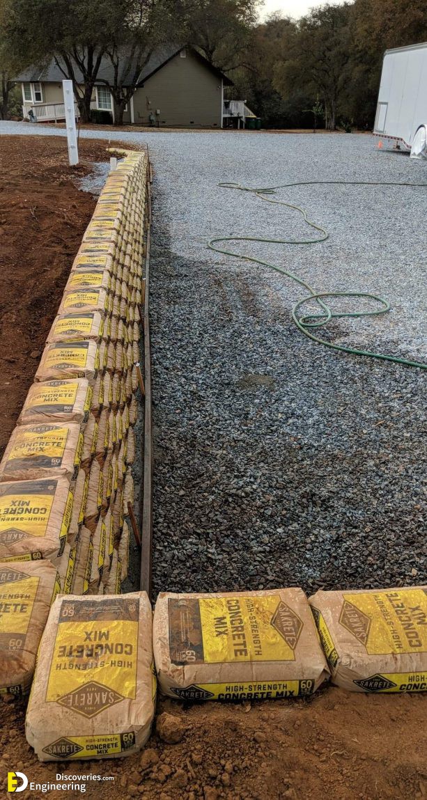 the-process-of-building-a-driveway-retaining-wall-from-Sakrete-bags-613x1149-1.jpg