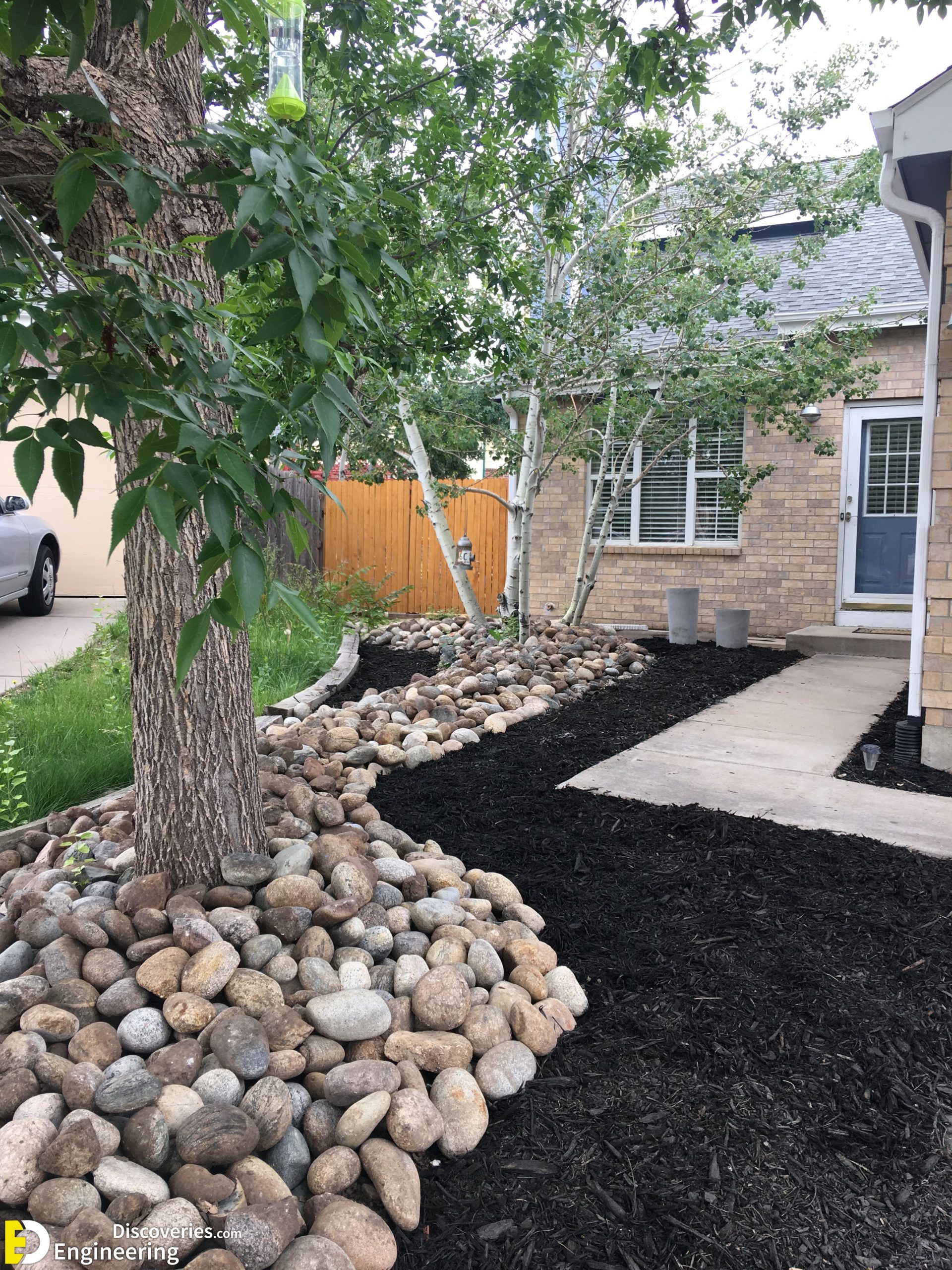 3-engineering-discoveries-nature-inspired-oasis-31-river-rock-landscaping-ideas-to-elevate-your-garden-scaled.jpg