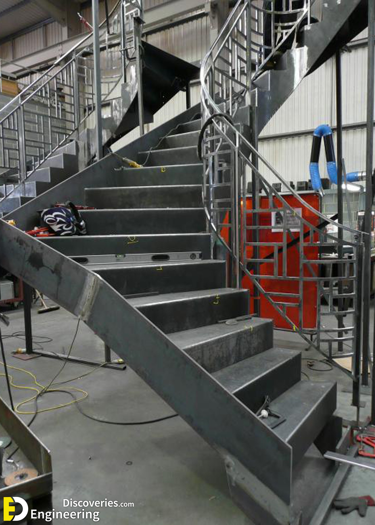 11-engineering-discoveries-272B-photos-of-iron-spiral-stairs-under-construction.jpg