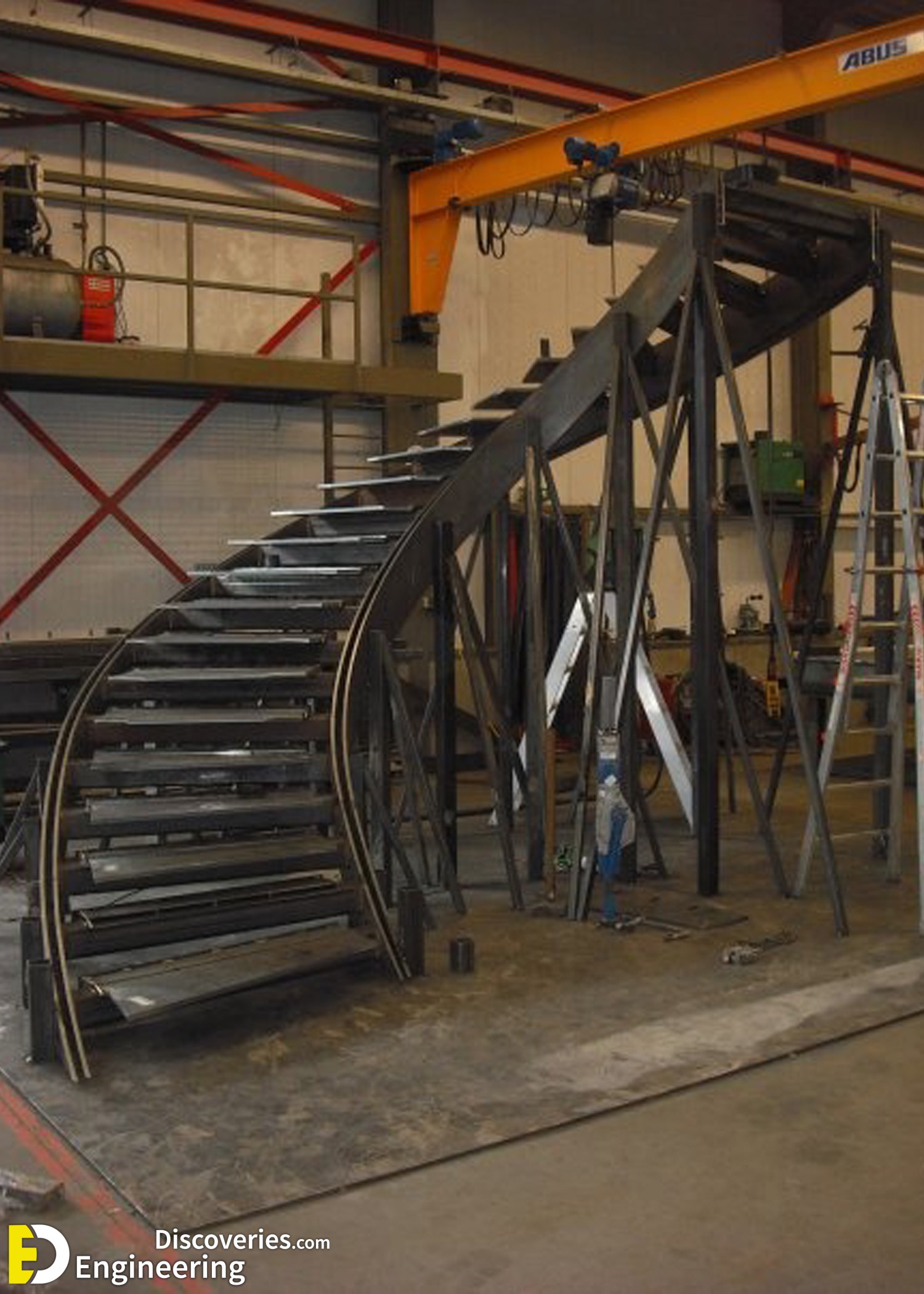 6-engineering-discoveries-272B-photos-of-iron-spiral-stairs-under-construction.jpg